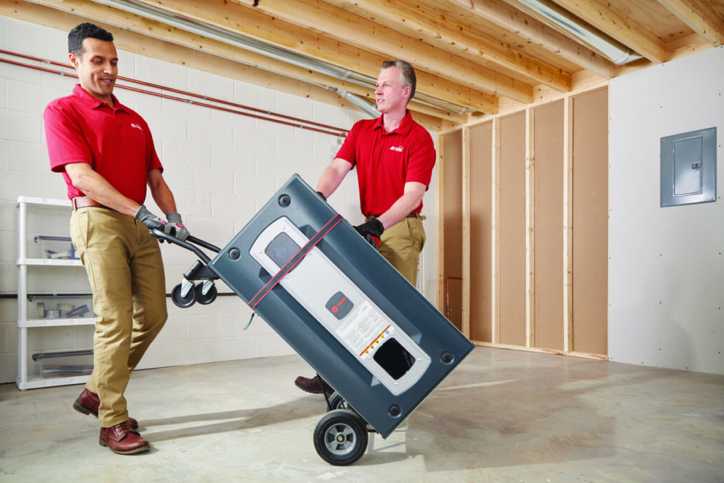 Technicians delivering a furnace for installation